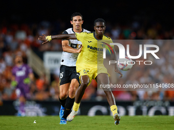 Thierno Barry of Villarreal CF competes for the ball with Cesar Tarrega of Valencia CF during the LaLiga EA Sports match between Valencia CF...