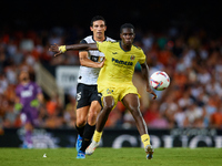 Thierno Barry of Villarreal CF competes for the ball with Cesar Tarrega of Valencia CF during the LaLiga EA Sports match between Valencia CF...