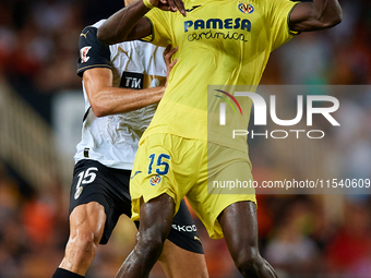 Thierno Barry of Villarreal CF competes for the ball with Cesar Tarrega of Valencia CF during the LaLiga EA Sports match between Valencia CF...