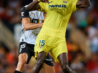 Thierno Barry of Villarreal CF competes for the ball with Cesar Tarrega of Valencia CF during the LaLiga EA Sports match between Valencia CF...