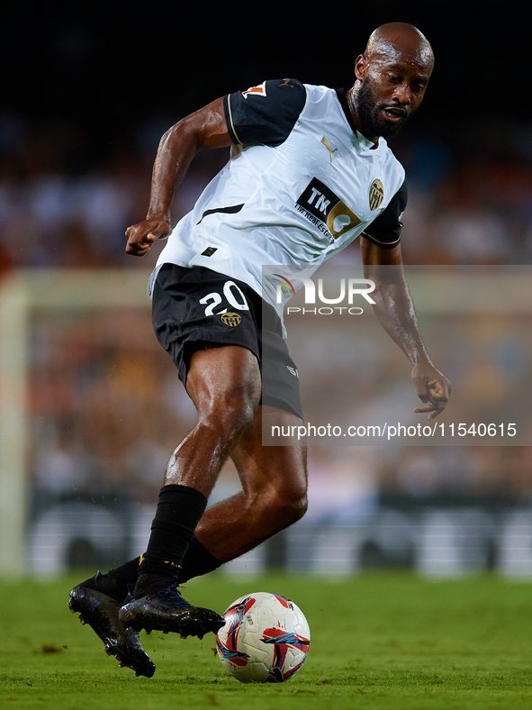 Dimitri Foulquier of Valencia CF is in action during the LaLiga EA Sports match between Valencia CF and Villarreal CF at Mestalla stadium in...