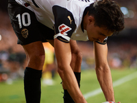 Andre Almeida of Valencia CF sets the ball on the corner spot during the LaLiga EA Sports match between Valencia CF and Villarreal CF at Mes...