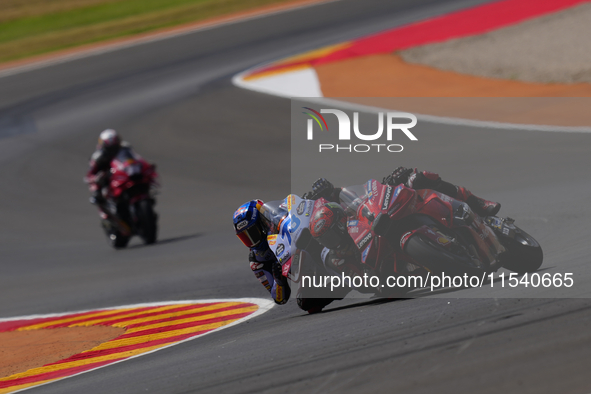 Francesco Pecco Bagnaia (1) of Italy and Ducati Lenovo Team crashing with Alex Marquez (73) of Spain and Gresini Racing Moto GP Ducati durin...