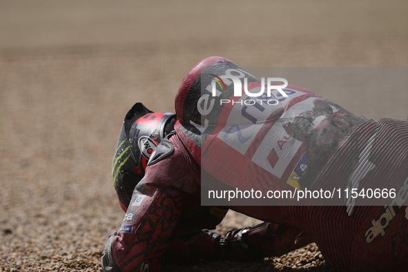 Francesco Pecco Bagnaia (1) of Italy and Ducati Lenovo Team after crashing with Alex Marquez (73) of Spain and Gresini Racing Moto GP Ducati...