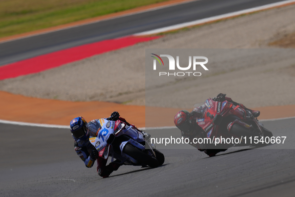 Francesco Pecco Bagnaia (1) of Italy and Ducati Lenovo Team before crashing with Alex Marquez (73) of Spain and Gresini Racing Moto GP Ducat...