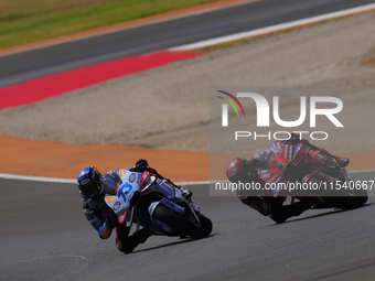 Francesco Pecco Bagnaia (1) of Italy and Ducati Lenovo Team before crashing with Alex Marquez (73) of Spain and Gresini Racing Moto GP Ducat...