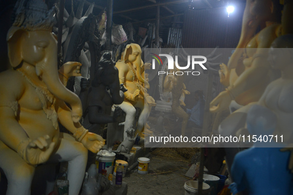 Artisans work on idols of the elephant-headed Hindu deity Ganesha at Kumartuli (artisan workshop) ahead of the Ganesh Chaturthi festival in...