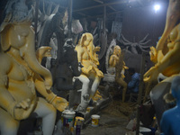 Artisans work on idols of the elephant-headed Hindu deity Ganesha at Kumartuli (artisan workshop) ahead of the Ganesh Chaturthi festival in...