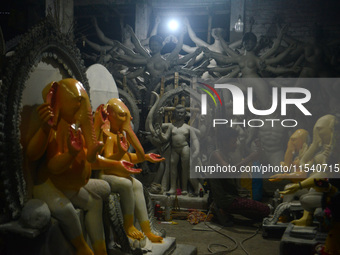 Artisans work on idols of the elephant-headed Hindu deity Ganesha at Kumartuli (artisan workshop) ahead of the Ganesh Chaturthi festival in...