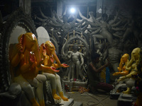 Artisans work on idols of the elephant-headed Hindu deity Ganesha at Kumartuli (artisan workshop) ahead of the Ganesh Chaturthi festival in...