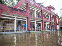 A few families take shelter in a school for 10 days after being affected by flood water in a village of Sonapur Union of Sonaimuri Upazila o...