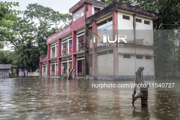 A few families take shelter in a school for 10 days after being affected by flood water in a village of Sonapur Union of Sonaimuri Upazila o...