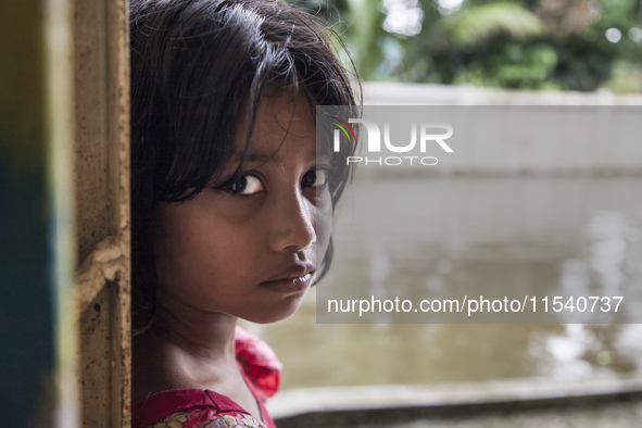 A small child looks innocent inside a flood shelter in Sonapur Union of Sonaimuri Upazila, Noakhali District, Chittagong Division, Banglades...