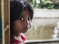 A small child looks innocent inside a flood shelter in Sonapur Union of Sonaimuri Upazila, Noakhali District, Chittagong Division, Banglades...