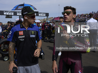 (L) Fabio Quartararo (20) of France and Monster Energy Yamaha Moto GP and (R) Tony Arbolino (14) of Italy and Elf Marc Vds Racing Team Kalex...