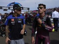 (L) Fabio Quartararo (20) of France and Monster Energy Yamaha Moto GP and (R) Tony Arbolino (14) of Italy and Elf Marc Vds Racing Team Kalex...