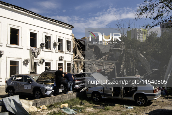 A view of the heavily damaged cars and partially collapsed building after the Russian missile attacks in Kyiv, Ukraine, on September 2, 2024...