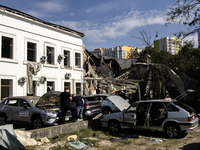 A view of the heavily damaged cars and partially collapsed building after the Russian missile attacks in Kyiv, Ukraine, on September 2, 2024...