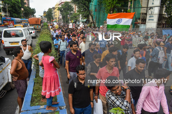 Children observe a protest rally by doctors regarding the rape and murder of a second-year PGT doctor in Kolkata, India, on September 2, 202...