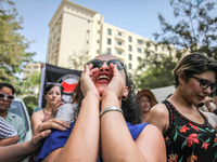 A female demonstrator shouts slogans as she attends a demonstration staged by human rights activists, women's rights organizations, and civi...