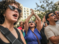 Demonstrators shout slogans as they attend a demonstration staged by human rights activists, women's rights organizations, and civil society...