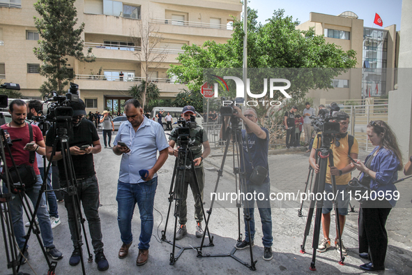 Photographers and journalists from the press and media cover a demonstration staged by human rights activists, women's rights organizations,...