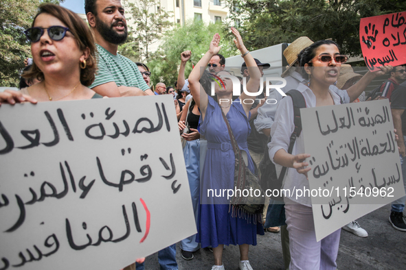 Demonstrators shout slogans as they attend a demonstration staged by human rights activists, women's rights organizations, and civil society...