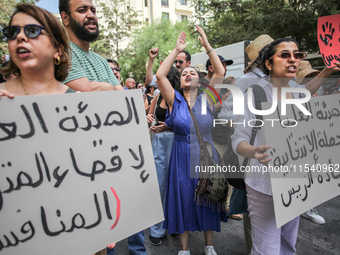 Demonstrators shout slogans as they attend a demonstration staged by human rights activists, women's rights organizations, and civil society...