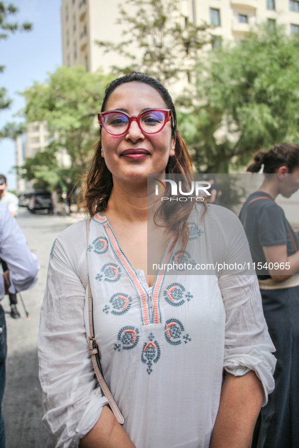 Chaima Issa, human rights activist and a senior member of the National Salvation Front, poses for photos as she attends a demonstration stag...