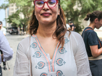 Chaima Issa, human rights activist and a senior member of the National Salvation Front, poses for photos as she attends a demonstration stag...