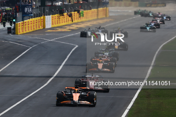 Oscar Piastri of McLaren and Charles Leclerc of Ferrari during the Formula 1 Italian Grand Prix at Autodromo Nazionale di Monza in Monza, It...