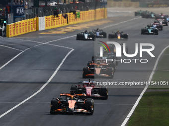 Oscar Piastri of McLaren and Charles Leclerc of Ferrari during the Formula 1 Italian Grand Prix at Autodromo Nazionale di Monza in Monza, It...