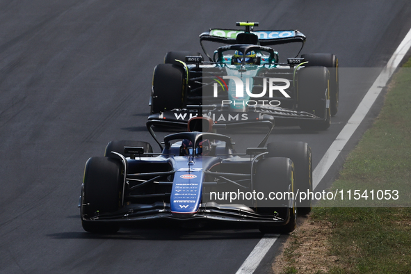 Franco Colapinto of Williams and Fernando Alonso of Aston Martin Aramco during the Formula 1 Italian Grand Prix at Autodromo Nazionale di Mo...