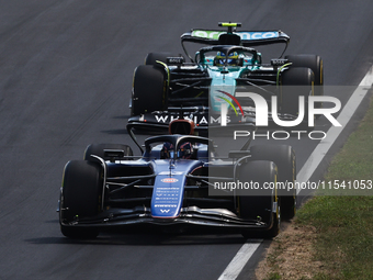 Franco Colapinto of Williams and Fernando Alonso of Aston Martin Aramco during the Formula 1 Italian Grand Prix at Autodromo Nazionale di Mo...