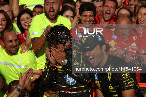 Charles Leclerc, Carlos Sainz of Ferrari and Frederic Vasseur celebrate with the team after the Formula 1 Italian Grand Prix at Autodromo Na...