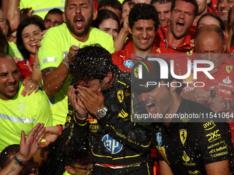 Charles Leclerc, Carlos Sainz of Ferrari and Frederic Vasseur celebrate with the team after the Formula 1 Italian Grand Prix at Autodromo Na...