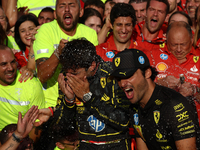 Charles Leclerc, Carlos Sainz of Ferrari and Frederic Vasseur celebrate with the team after the Formula 1 Italian Grand Prix at Autodromo Na...