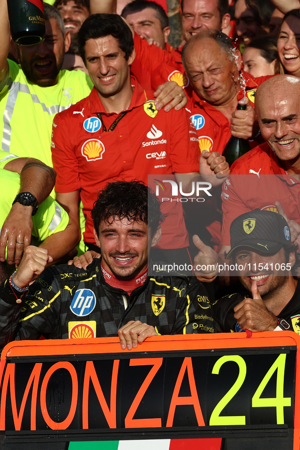 Charles Leclerc, Carlos Sainz of Ferrari and Frederic Vasseur celebrate with the team after the Formula 1 Italian Grand Prix at Autodromo Na...