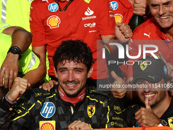 Charles Leclerc, Carlos Sainz of Ferrari and Frederic Vasseur celebrate with the team after the Formula 1 Italian Grand Prix at Autodromo Na...