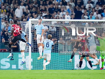 Strahinja Pavlovic of AC Milan scores first goal during the Serie A Enilive match between SS Lazio and AC Milan at Stadio Olimpico on Aug 31...