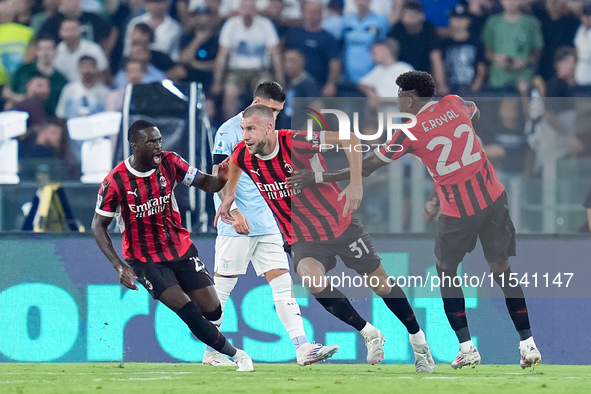 Strahinja Pavlovic of AC Milan celebrates after scoring first goal during the Serie A Enilive match between SS Lazio and AC Milan at Stadio...