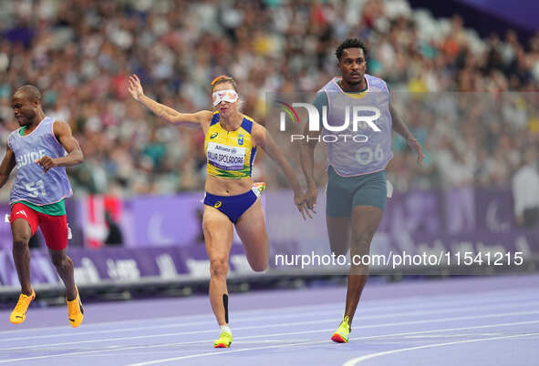 Lorena Silva Spoladore of Brazil celebrates winning gold in Women's 100m - T11 Semi-Finals during the Paris 2024 Paralympic Games at Stade d...