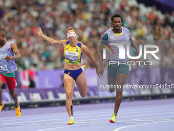 Lorena Silva Spoladore of Brazil celebrates winning gold in Women's 100m - T11 Semi-Finals during the Paris 2024 Paralympic Games at Stade d...