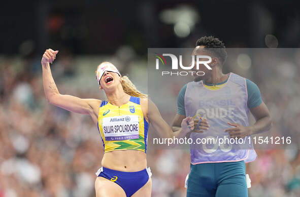 Lorena Silva Spoladore of Brazil celebrates winning gold in Women's 100m - T11 Semi-Finals during the Paris 2024 Paralympic Games at Stade d...