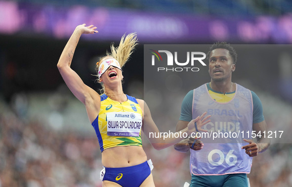 Lorena Silva Spoladore of Brazil celebrates winning gold in Women's 100m - T11 Semi-Finals during the Paris 2024 Paralympic Games at Stade d...