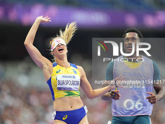 Lorena Silva Spoladore of Brazil celebrates winning gold in Women's 100m - T11 Semi-Finals during the Paris 2024 Paralympic Games at Stade d...