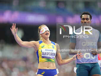 Lorena Silva Spoladore of Brazil celebrates winning gold in Women's 100m - T11 Semi-Finals during the Paris 2024 Paralympic Games at Stade d...