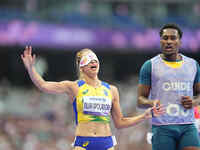 Lorena Silva Spoladore of Brazil celebrates winning gold in Women's 100m - T11 Semi-Finals during the Paris 2024 Paralympic Games at Stade d...