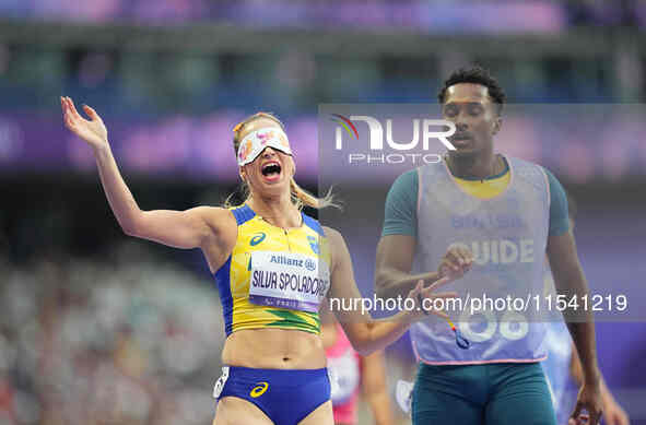 Lorena Silva Spoladore of Brazil celebrates winning gold in Women's 100m - T11 Semi-Finals during the Paris 2024 Paralympic Games at Stade d...