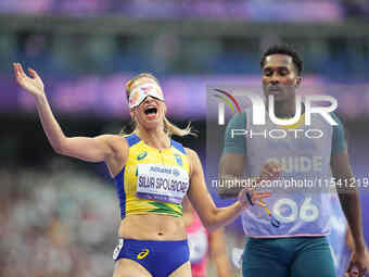 Lorena Silva Spoladore of Brazil celebrates winning gold in Women's 100m - T11 Semi-Finals during the Paris 2024 Paralympic Games at Stade d...